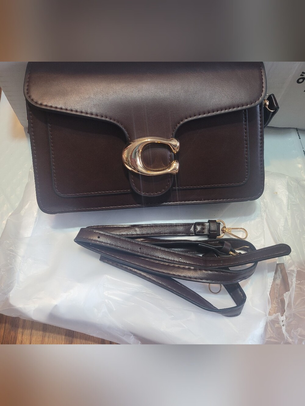 Small chocolate cross body bag, (no name brand.)